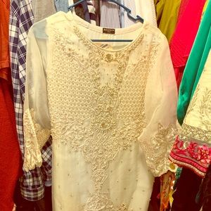 Fancy white shirt pearl work on it